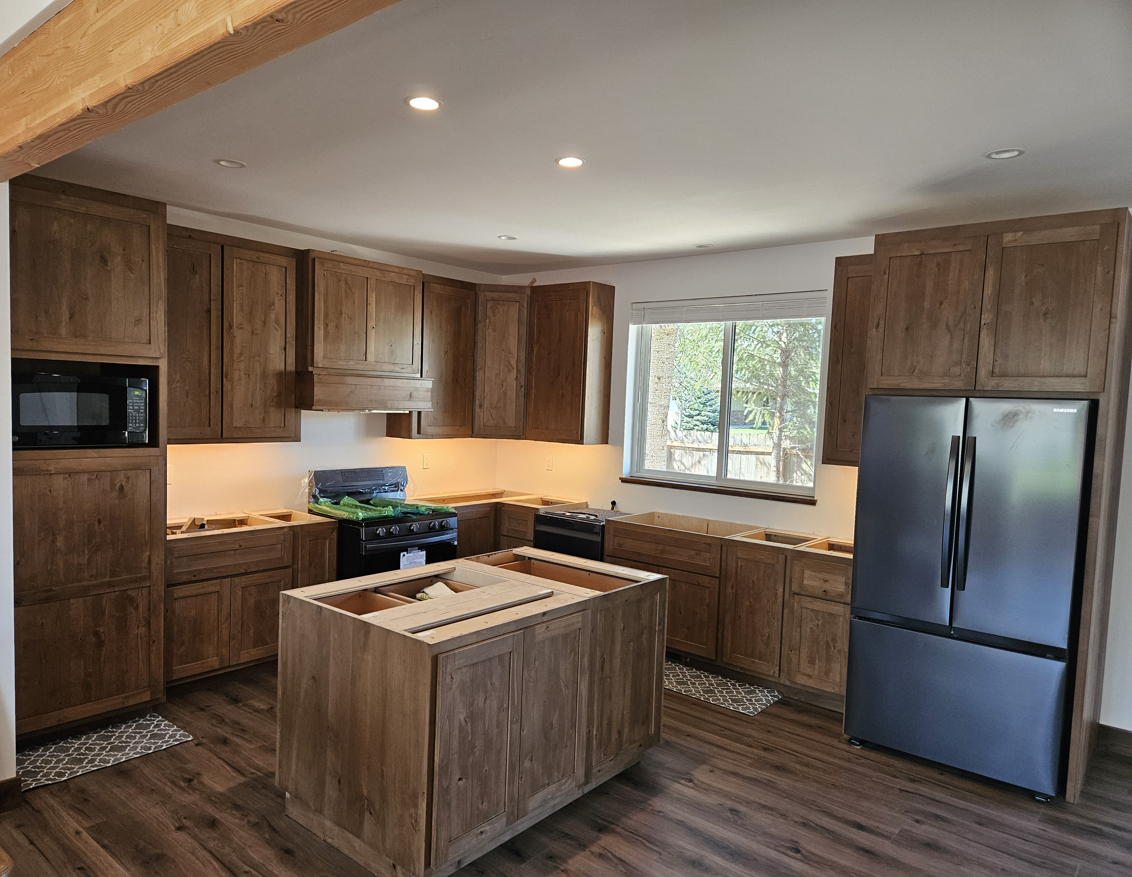 Custom cabinetry installation progress in new construction